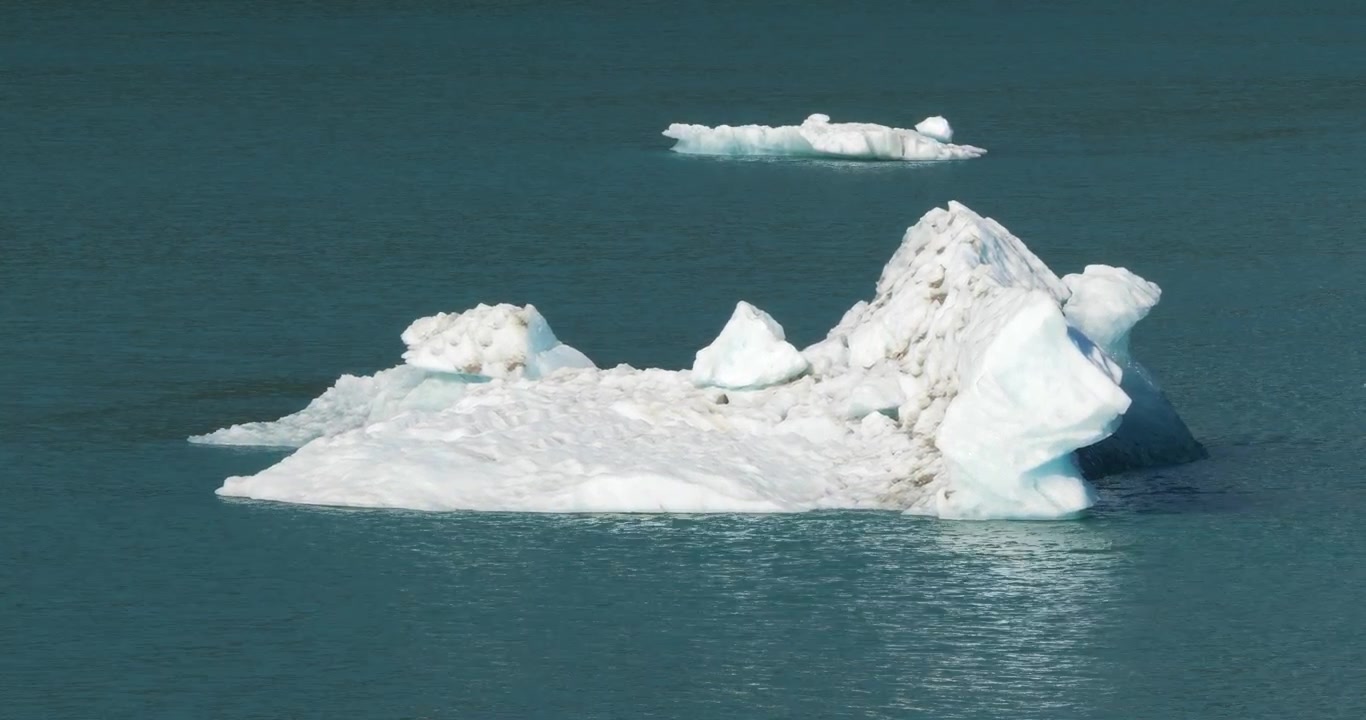 Massive iceberg floating in Endicott Arm fjord near Dawes Glacier, Alaska.Beautiful unique shapes of icebergs calved from Dawes Glacier.