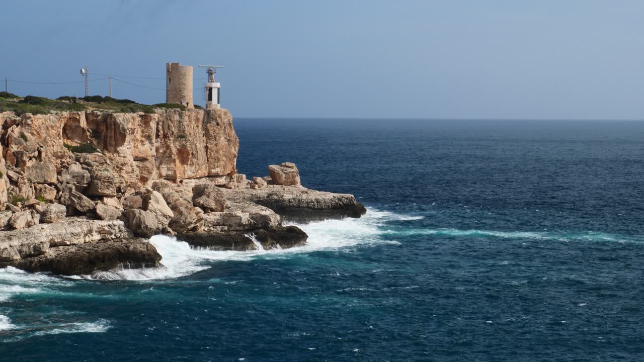 View of the Torre d'en Beu lighthouse in Cala Figuera, Mallorca, Spain
