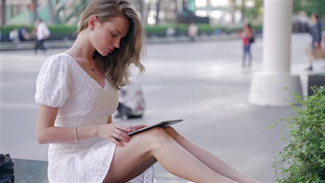 woman using tablet in the city