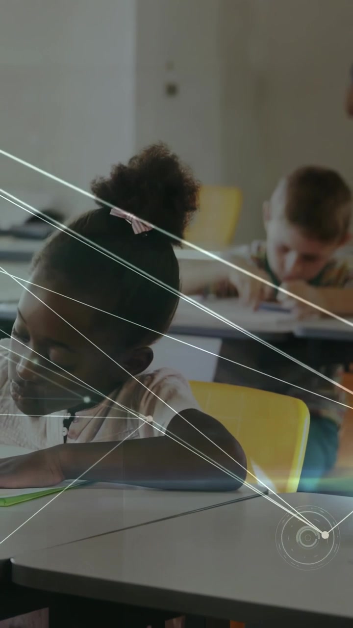 Vertical video: Girl doing worksheet for class, camera pulling back revealing light web across desk