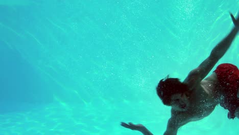 Happy-man-diving-into-swimming-pool