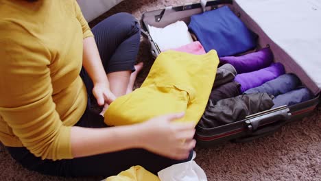 young woman preparation suitcase getting ready for road trip preparing luggage for vacation