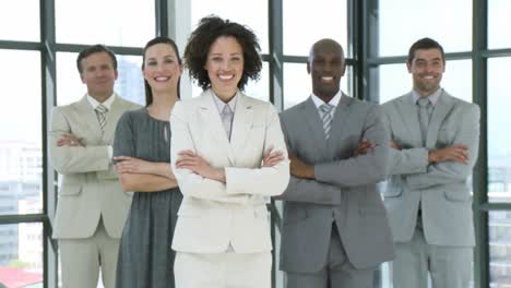 multiethnic business team standing with folded arms