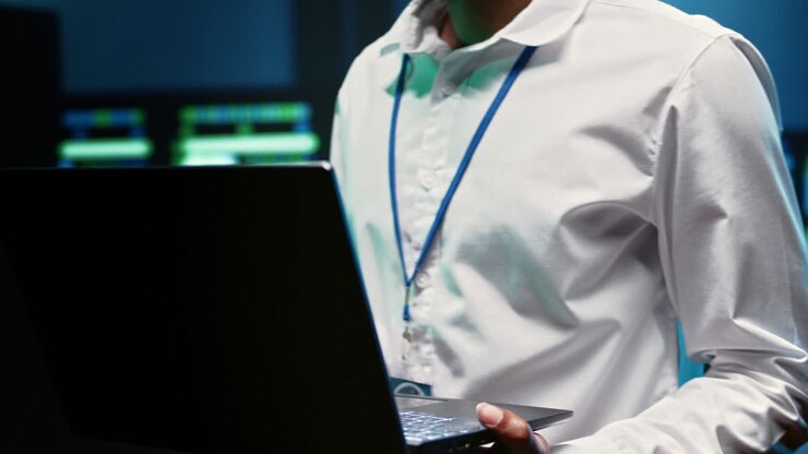 Engineer in data center fixing issues