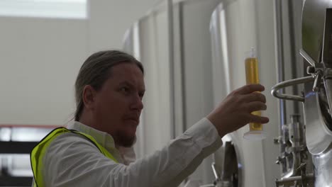 caucasian man working at a microbrewery