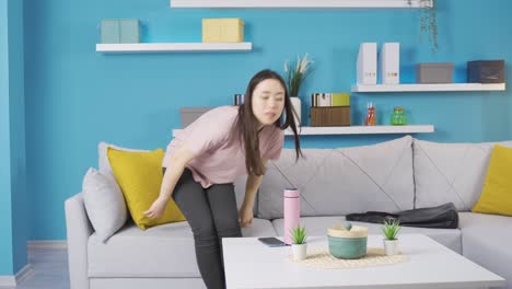 young asian woman with bad smell in socks is disgusted by the smell.