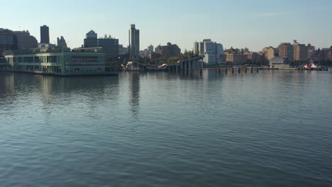 a drone view over a calm and empty hudson river on a sunny day