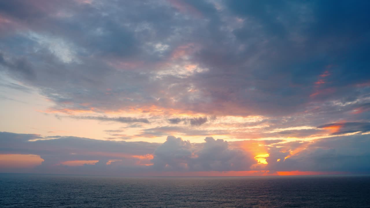 Dense Clouds With Sunset Glow Over The Seascape Of Algarve, Portugal. Slow Motion Shot