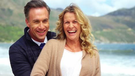 mature couple enjoying on beach