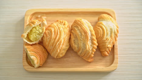 curry puff pastry stuffed beans on wooden plate