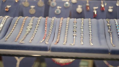 silver bracelets with gemstones on display in a jewelry store