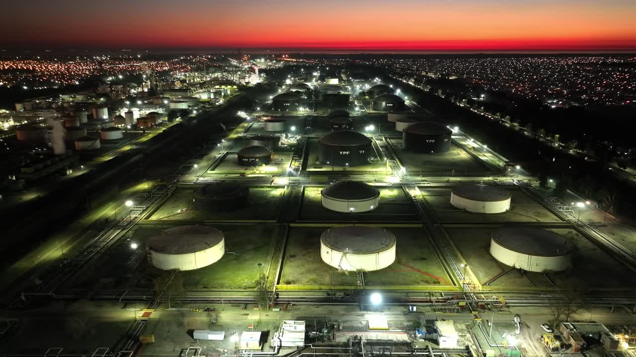Oil processing site at dusk, industry and technology plant