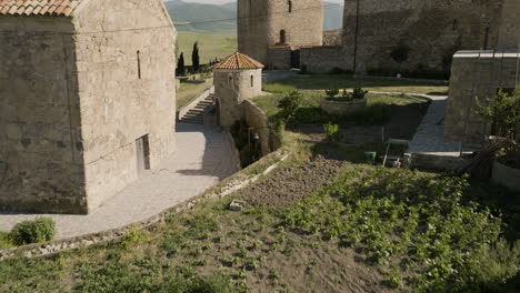 Medieval-Samtsevrisi-castle-courtyard,-georgian-countryside-around