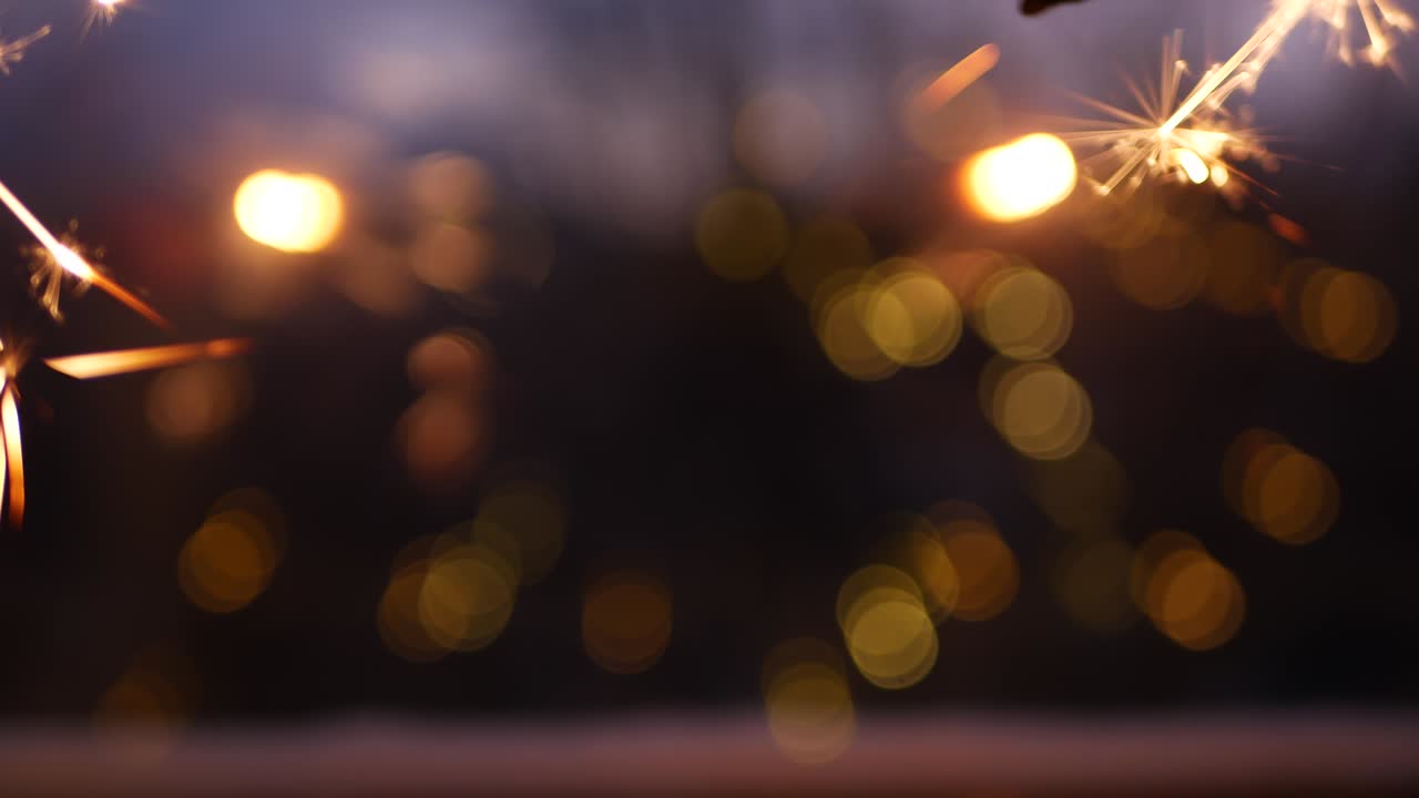 Sparkler firework burning on window, New Year or Christmas bengal lights glowing