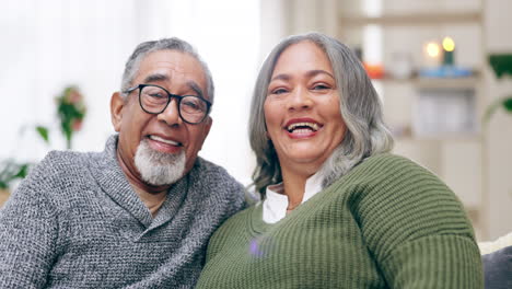 elderly couple, sofa and smile on face with hug
