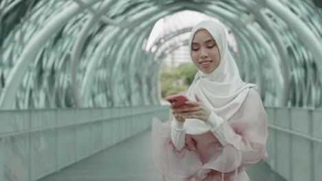 woman taking a selfie in a modern city bridge tunnel