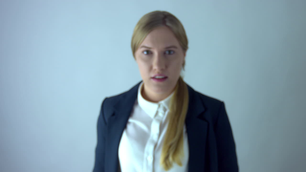 Business woman presses virtual emergency button with fist