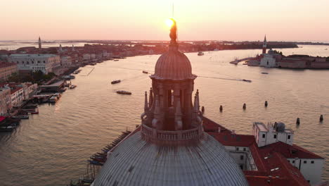 aerial view of santa maria della salute and san marco square at sunrise, italy