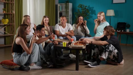 teenagers enjoying pizza party at home