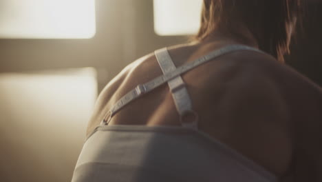 woman exercising back muscles