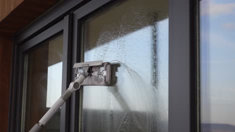 window cleaning with squeegee