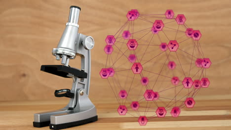 digital composite video of network of connection with interface icons forming a globe and microscope