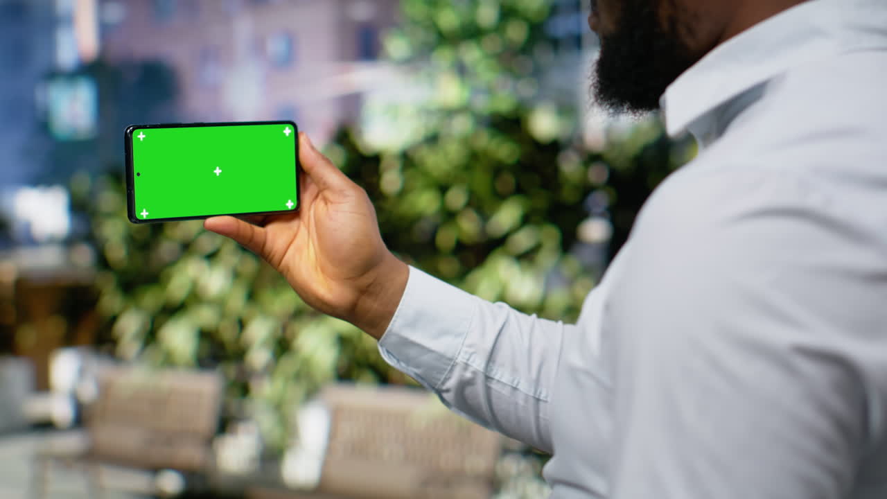 Horizontal mockup screen with adult male outdoor on city center sidewalk