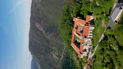VERTICAL-monastery-santo-estevo-of-ribas-of-sil,-ourense,-galicia,-spain,-aerial-orbit