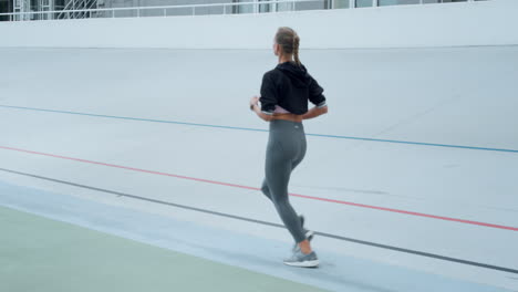 Woman-with-artificial-limb-jogging-on-track