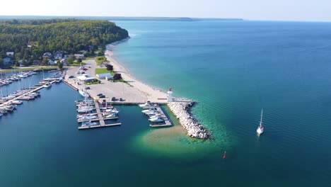 wide aerial footage of sailboat marina and shore in georgian bay, ontaria, canada