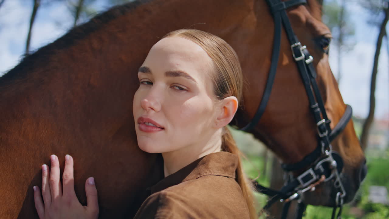 Affectionate woman bonding equine park closeup. Lady posing with horse