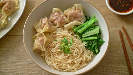 dried egg noodles with pork wonton or pork dumplings without soup asian food style