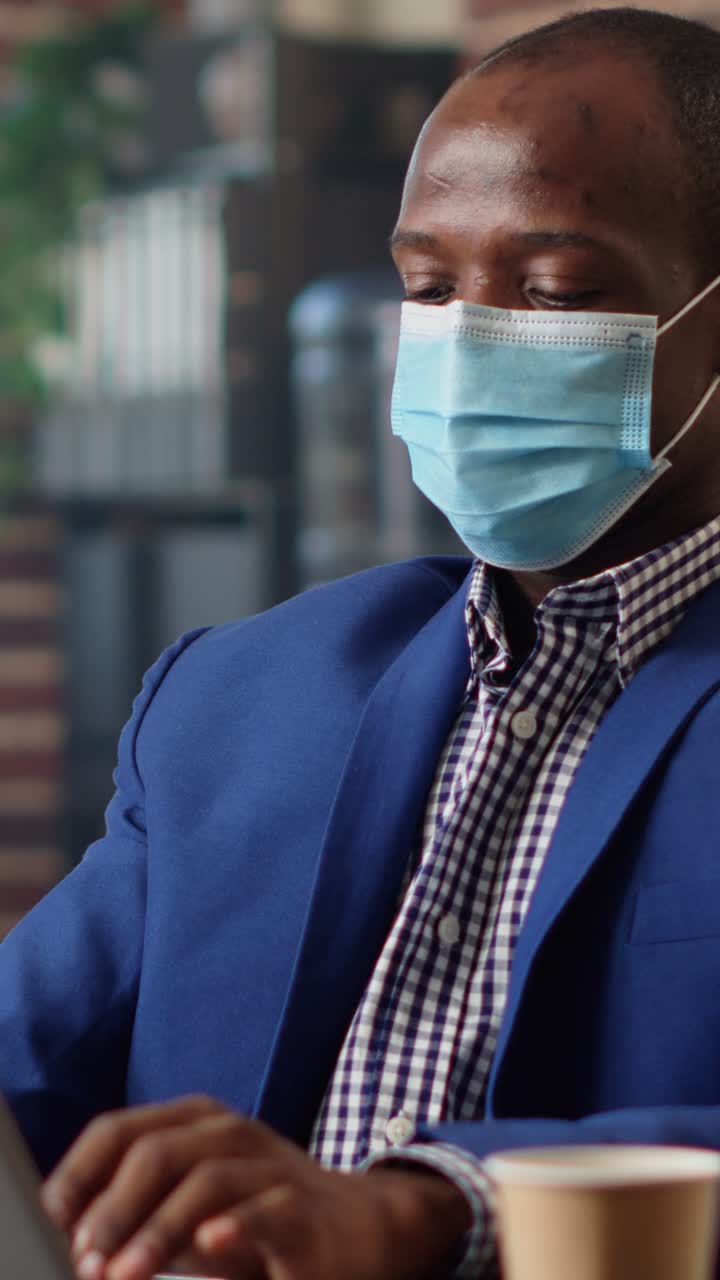 Man wearing a mask working