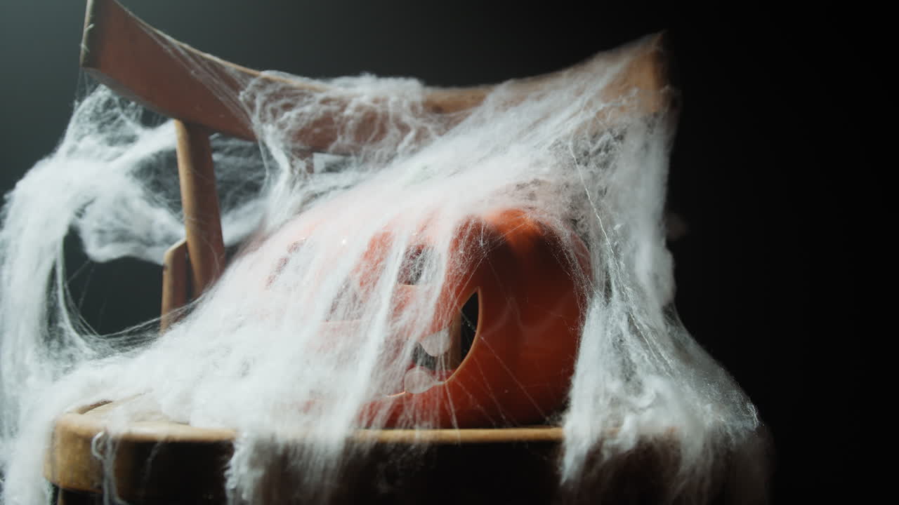 Chair with Spider Web and Halloween Pumpkin