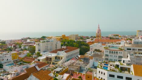 aerial drone shot of cartagena city in colombia, the ocean and the buildings