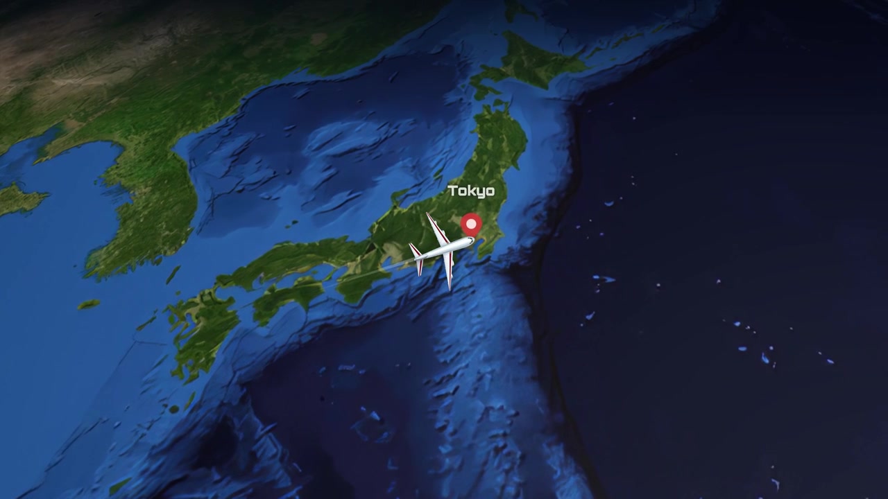 Satellite view animation follows a commercial airplane flying from Guangzhou, China to Tokyo, Japan