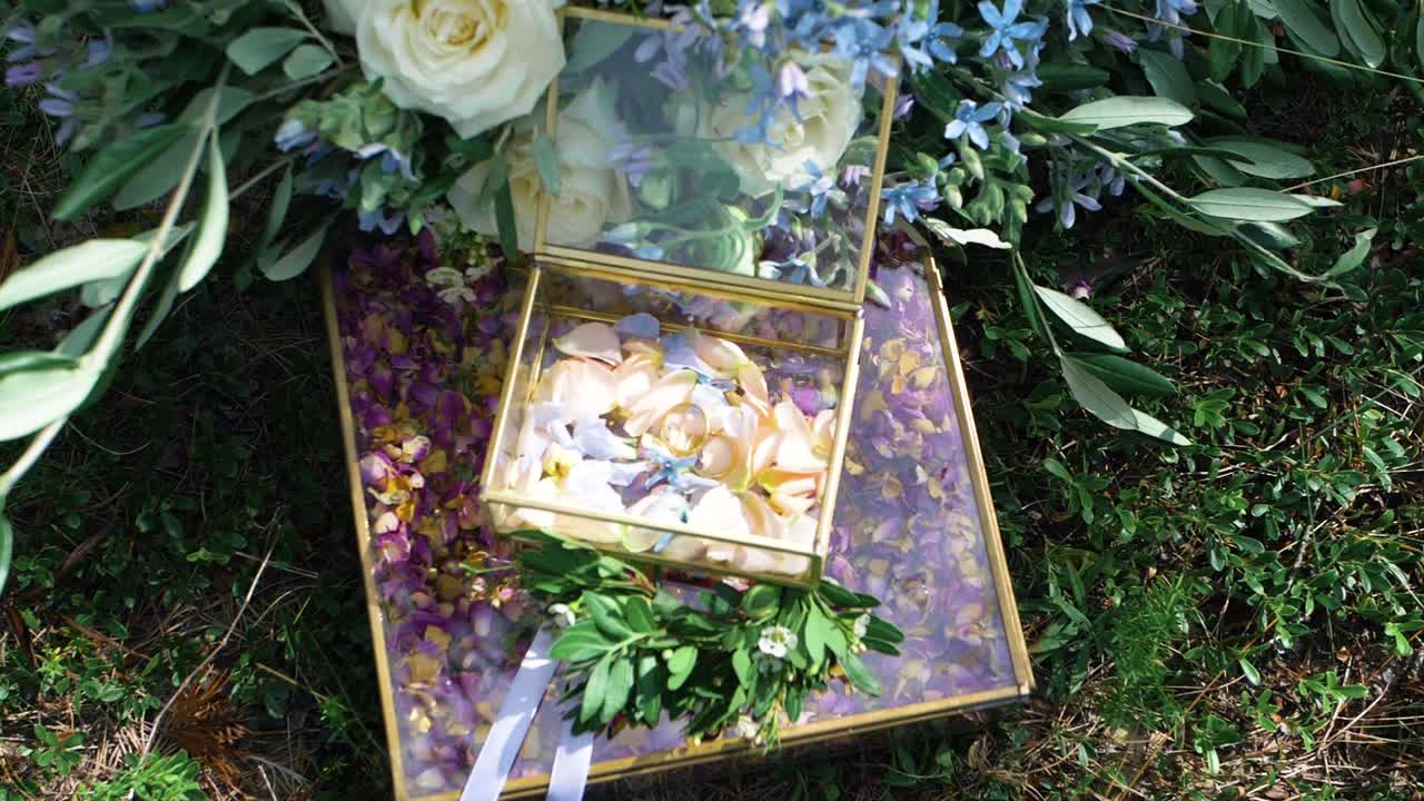 Wedding bouquet with petals surrounded by flowers.