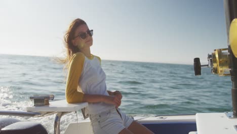 Side-view-of-a-teenage-Caucasian-girl-enjoying-her-time-on-a-boat