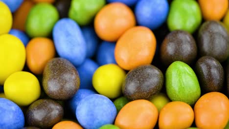 chocolate coated peanuts on a rotating table (seamless loopable)