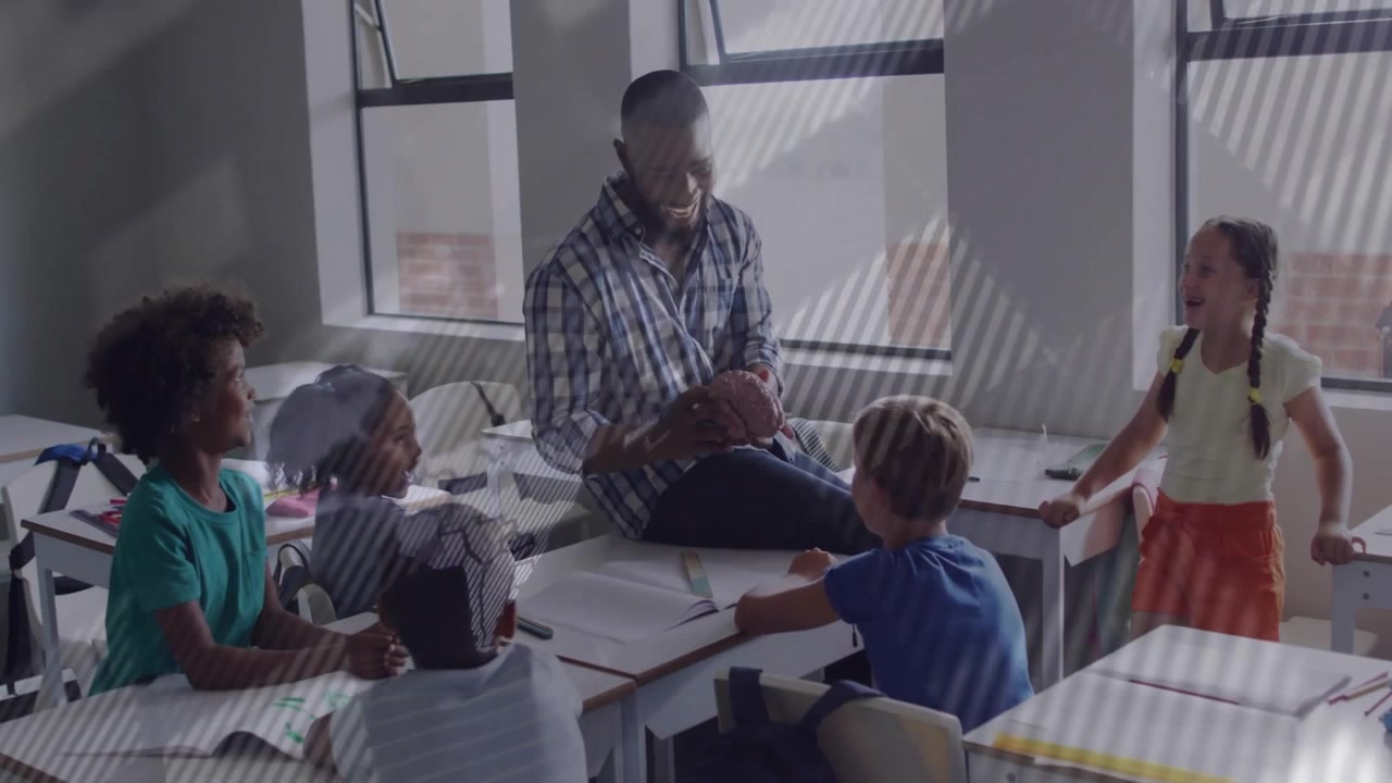 Rotating globe overlay dissolving teacher lifting football showing stitching to engage students