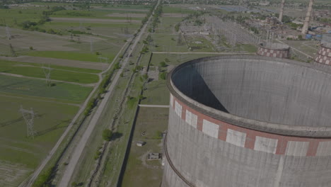 Aerial-view-of-mtkvari-thermal-power-plant-with-cooling-towers-during-sunny-day-in-Georgia,Europe