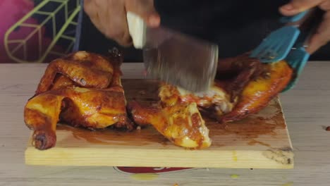 Slicing-roasted-chiken-on-cuttingboard