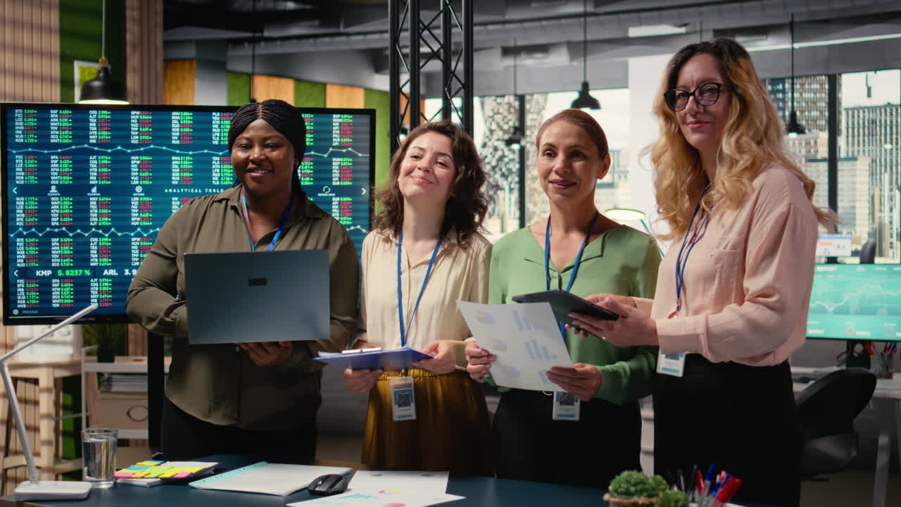 Vertical Video Ambitious and goal oriented diverse businesswomen reviewing corporate reports
