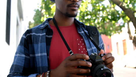 hipster is taking a picture with a camera