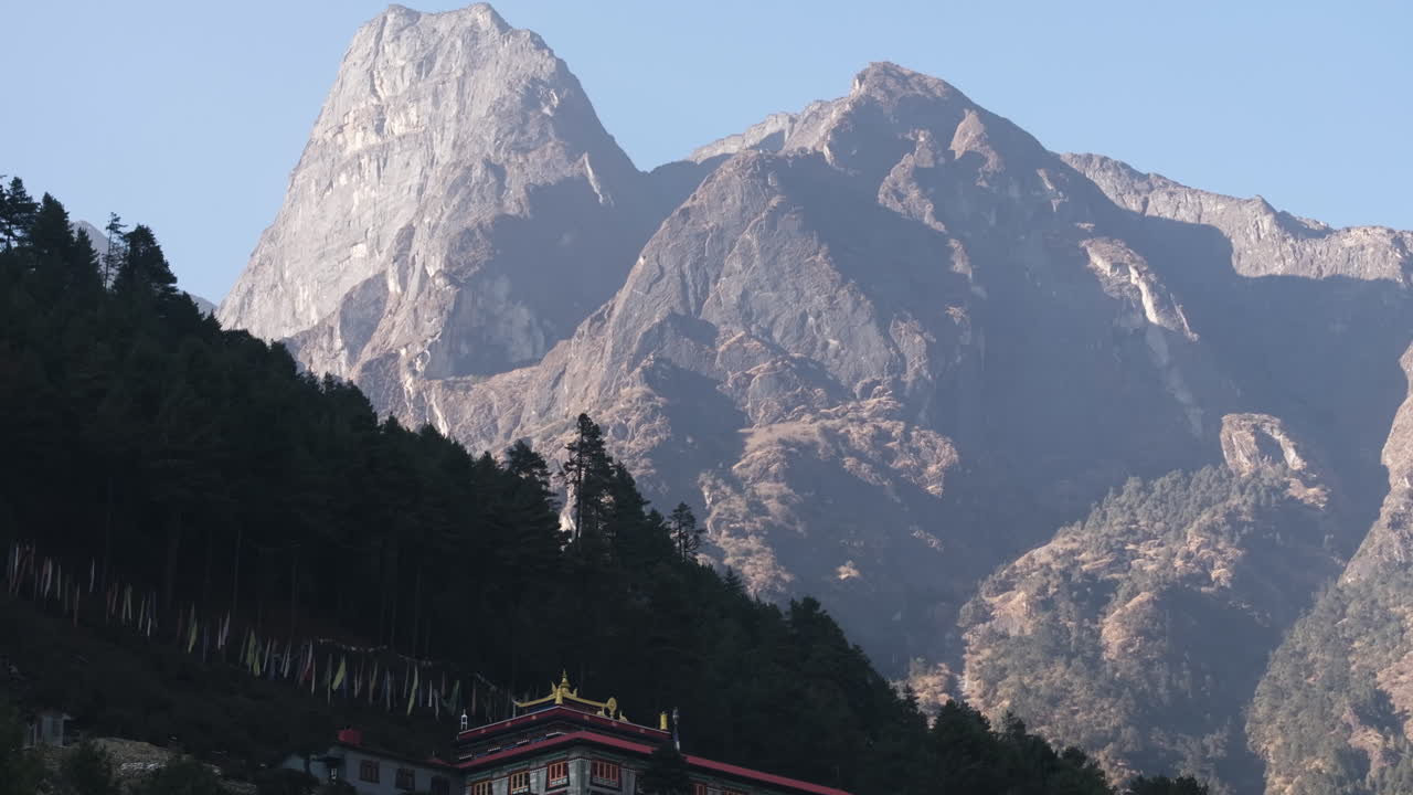 Aerial view of tall mountains and the Phakding Monastery in Sagarmatha, Nepal