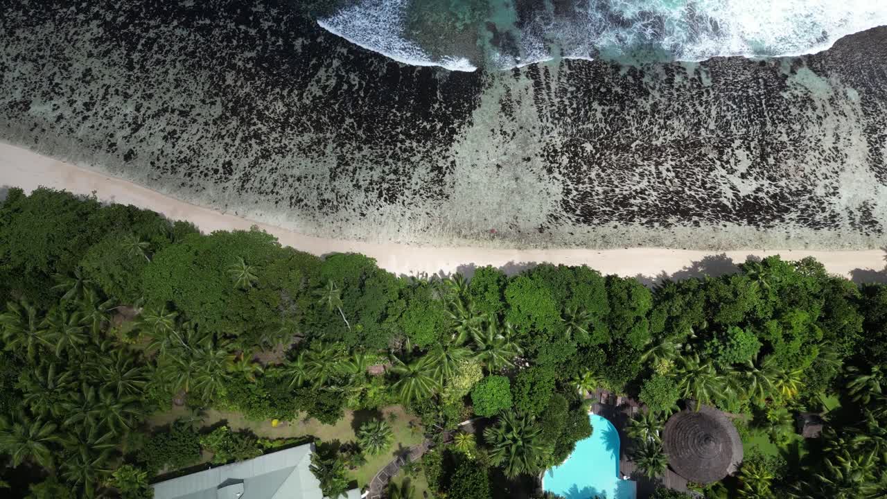 Aerial View of Tropical Beach with Turquoise Water and Resort