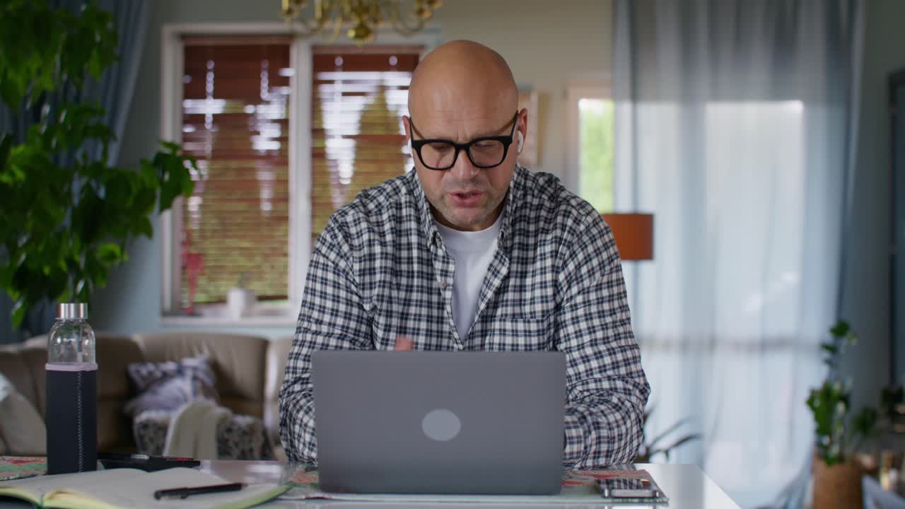 Man on video call at home