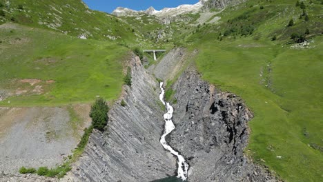 le rieu claret river waterfall in french alps, isere savoy, france - aerial forward