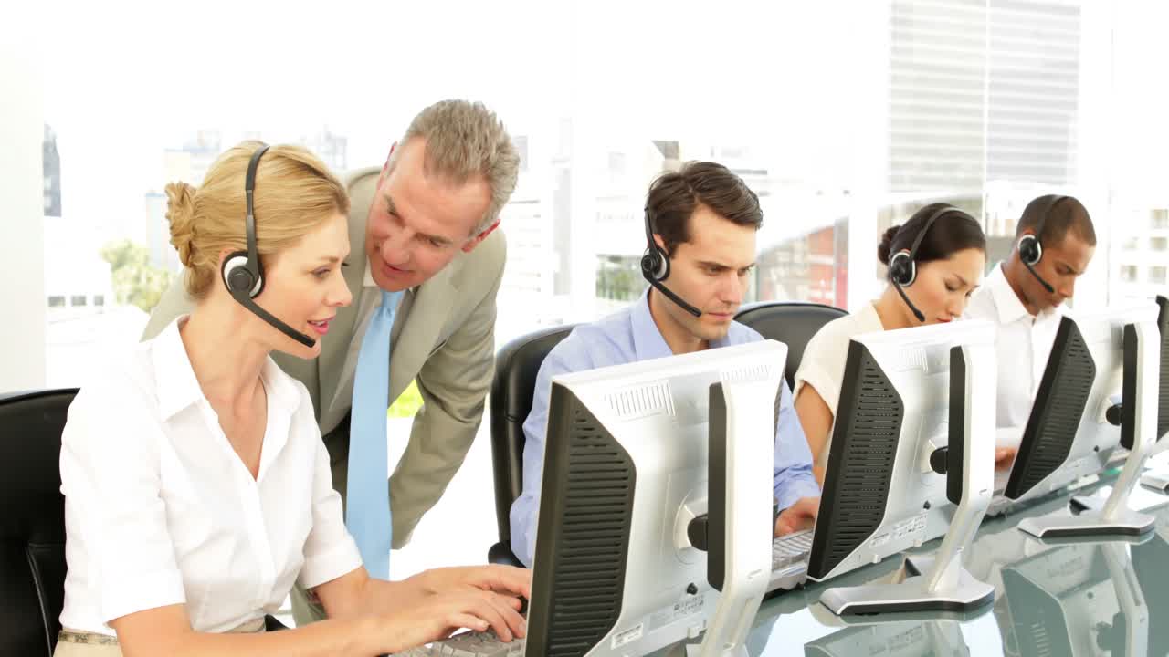 Manager checking in on call centre employees