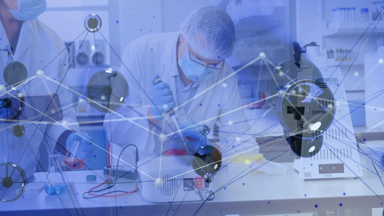 After female tech holding vial male tech pipetting at bench network overlay marking wells for test